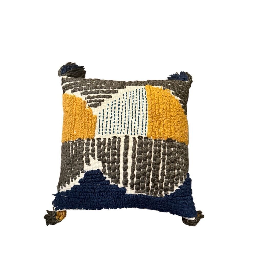 Pier 1 square boho embroidered blue, grey, and yellow decorative pillow.